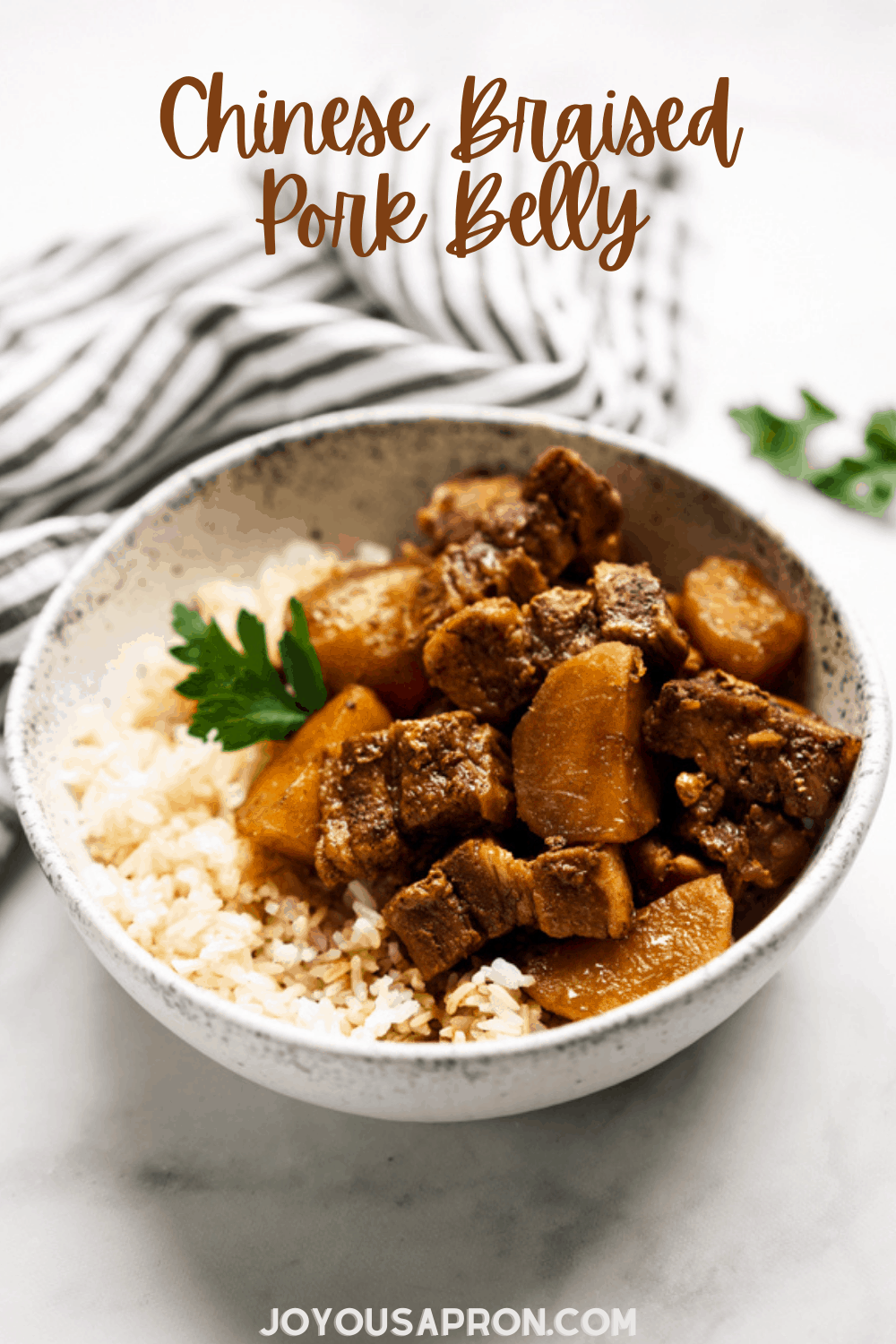 Braised Pork Belly - A classic Asian and Chinese dish. Lean pork belly and potatoes slow cooked in a savory sweet soy based herb sauce until tender. Served with rice for the ultimate comfort food meal! via @joyousapron