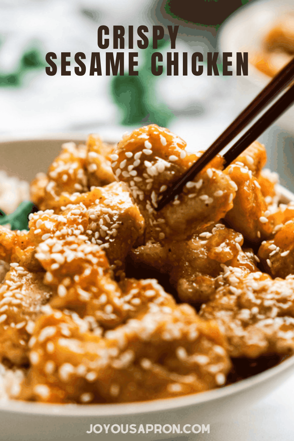 Sesame Chicken - Crispy breaded chicken coated in a sticky sweet Asian inspired Honey Sesame Sauce. This chicken recipe is easy, delicious, and much healthier than Chinese takeout! via @joyousapron