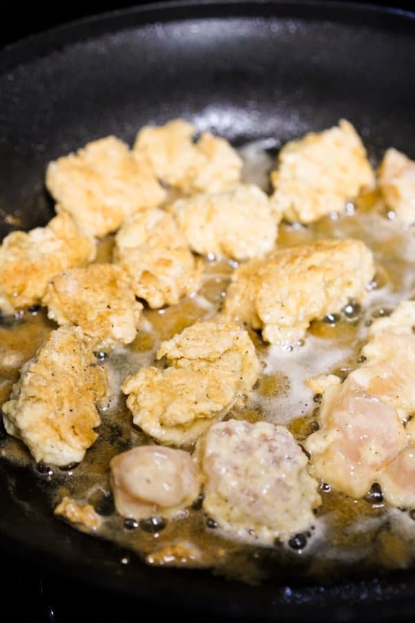 Pan frying crispy chicken in oil