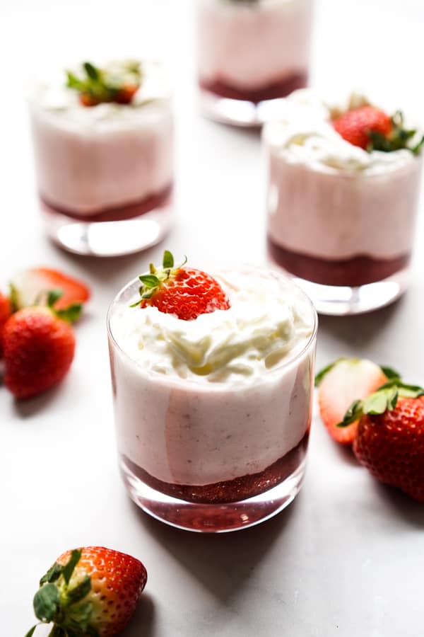 Four small glasses of strawberry mousse