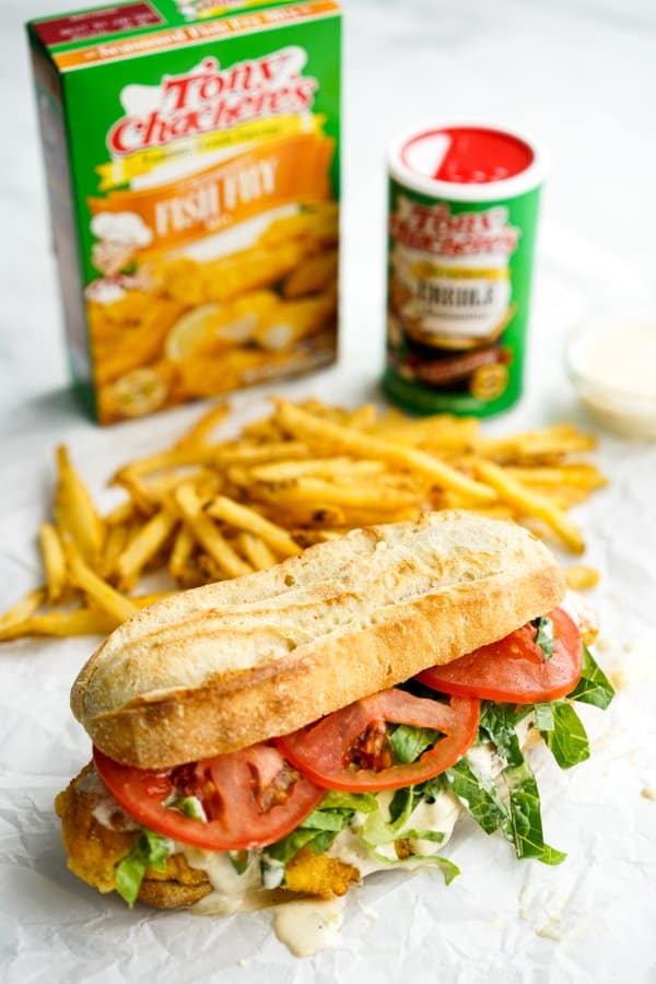 Fish Po' Boy sandwich with fries, Tony Chachere's seasonings in the background