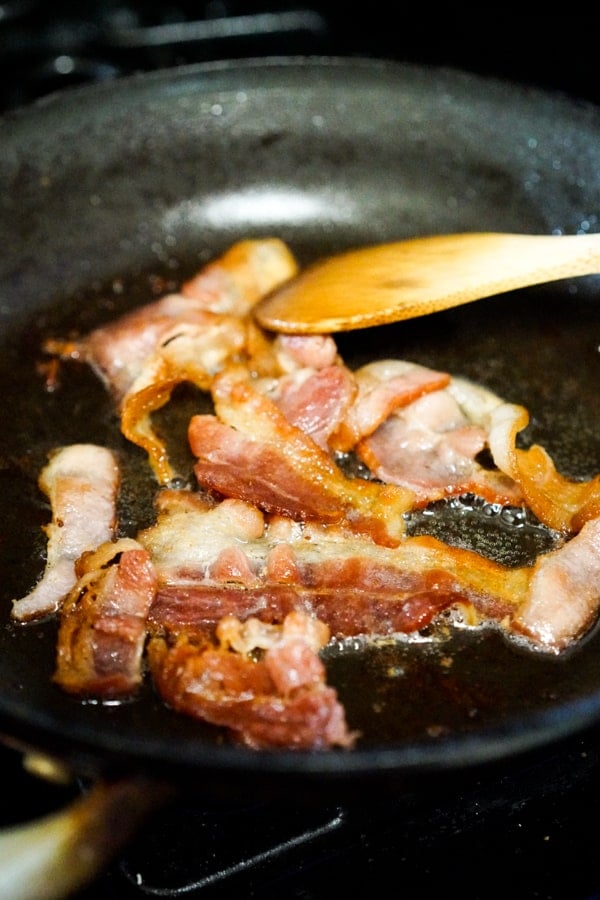 Cooking bacon in frying pan