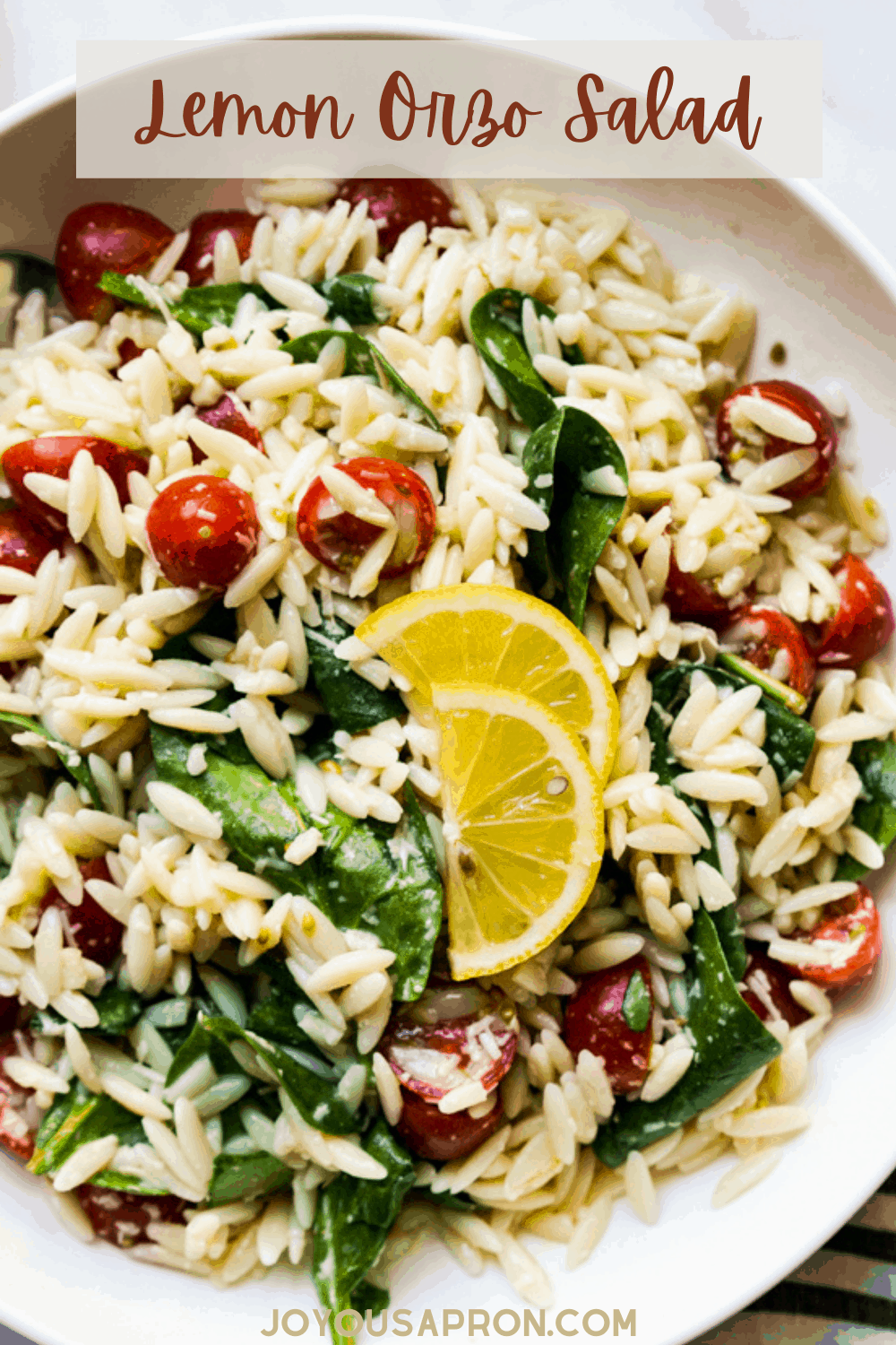 Lemon Orzo Salad - healthy and easy side dish recipe! Chewy orzo pasta combined with spinach and cherry tomatoes, tossed in a garlic lemon juice dressing, sprinkled with parmesan cheese. via @joyousapron