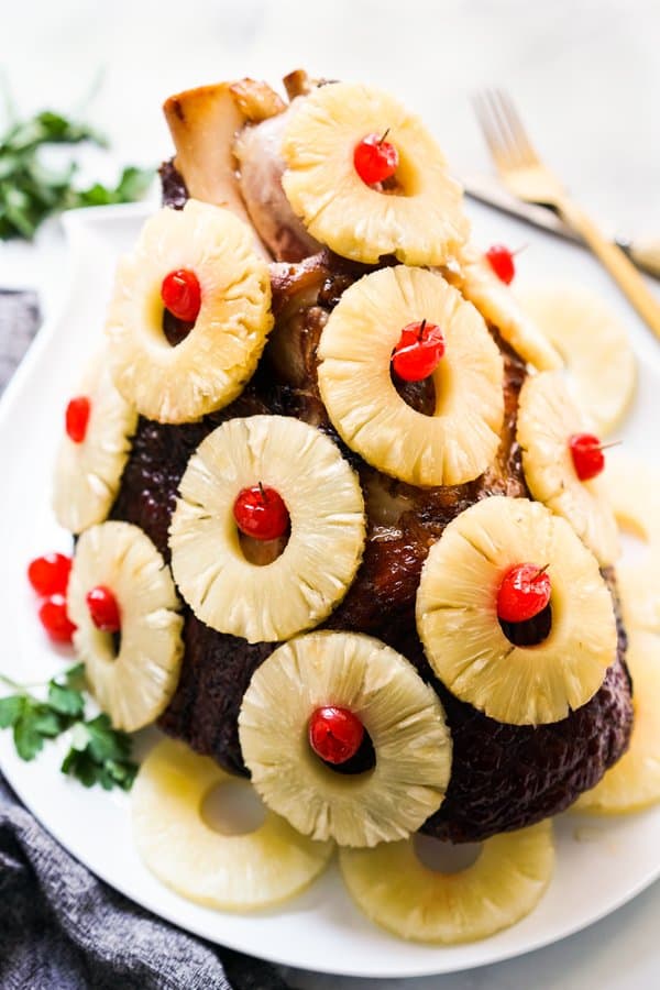 Bone in ham covered with pineapple rings and cherries