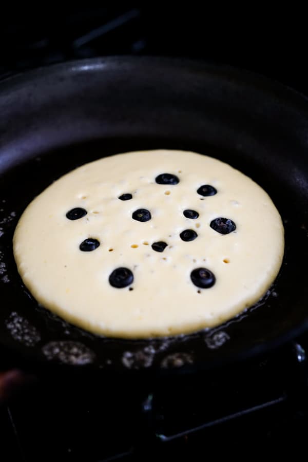 Bubbles forming across the surface of the pancake 