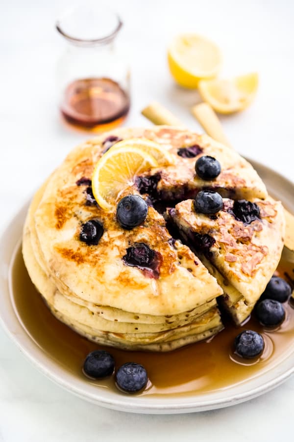 Cutting out a slice of pancake from a stack