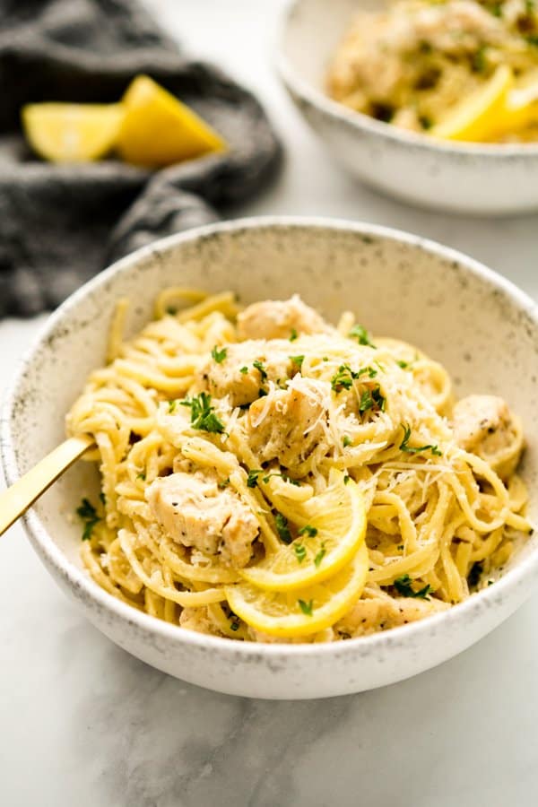 Fork tangled in linguini in Creamy Lemon Chicken Pasta dish.