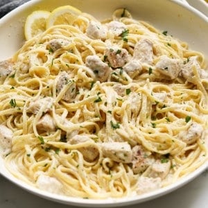 A skillet loaded with creamy lemon chicken pasta