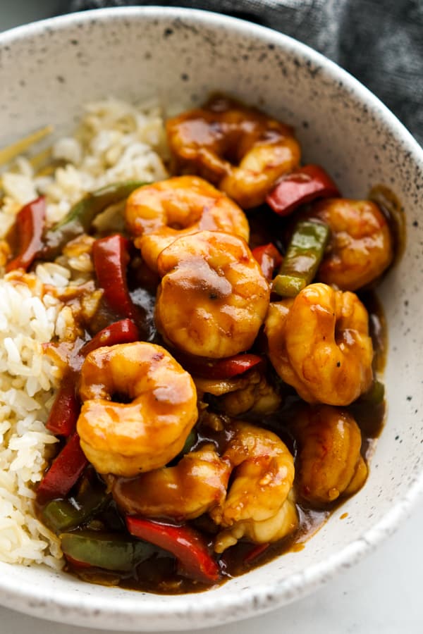 Closeup of Shrimp Stir fry with bell peppers tossed in sticky sauce