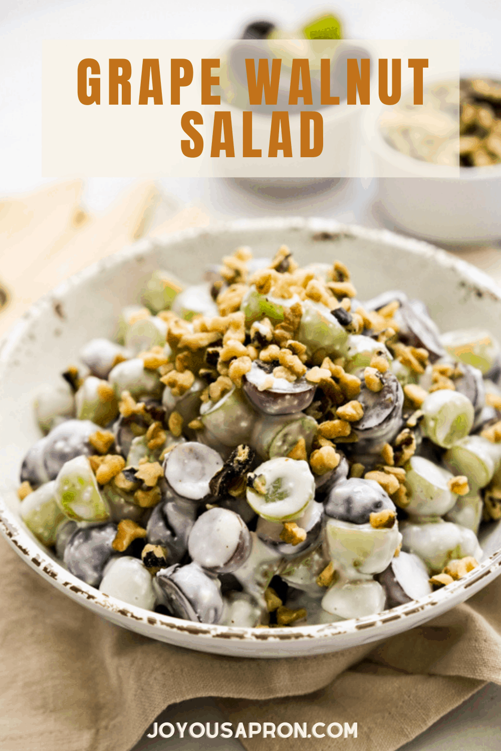 Grape Walnut Salad - easy, healthy and delicious fruit salad side dish for the summer. Red and green grapes tossed with walnuts in a creamy sweet and tangy dressing. Perfect for picnics, cookout and more! via @joyousapron