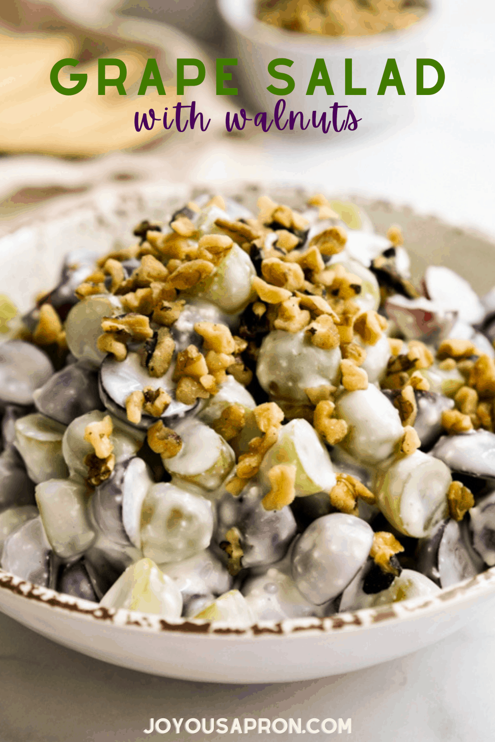 Grape Walnut Salad - easy, healthy and delicious fruit salad side dish for the summer. Red and green grapes tossed with walnuts in a creamy sweet and tangy dressing. Perfect for picnics, cookout and more! via @joyousapron