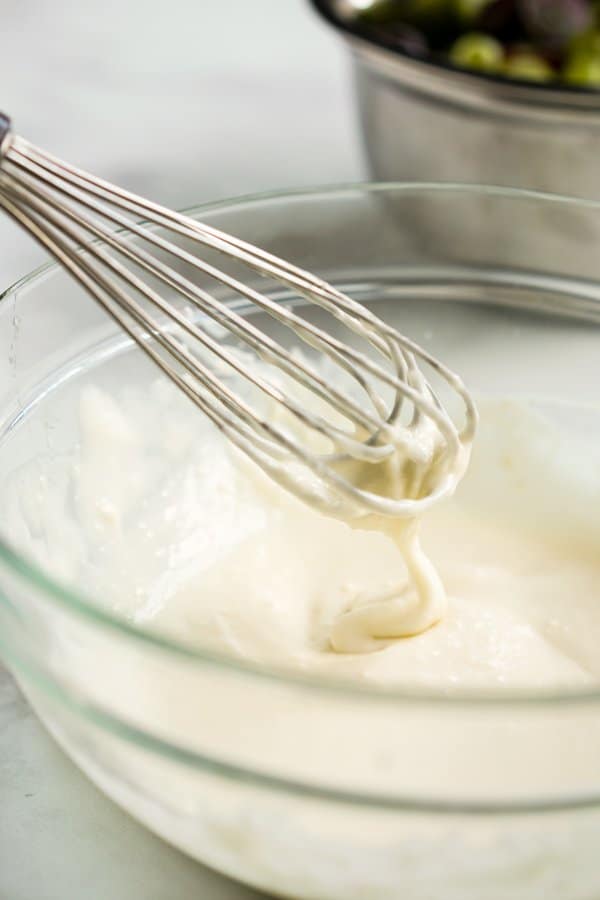 Whisking cream cheese and sour cream dressing