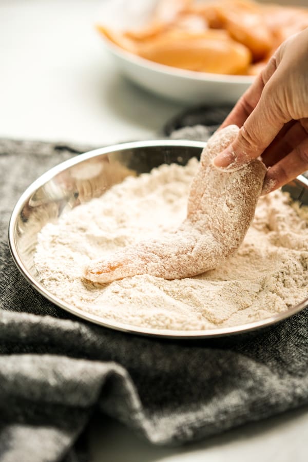 Coat chicken tenders in flour mixture