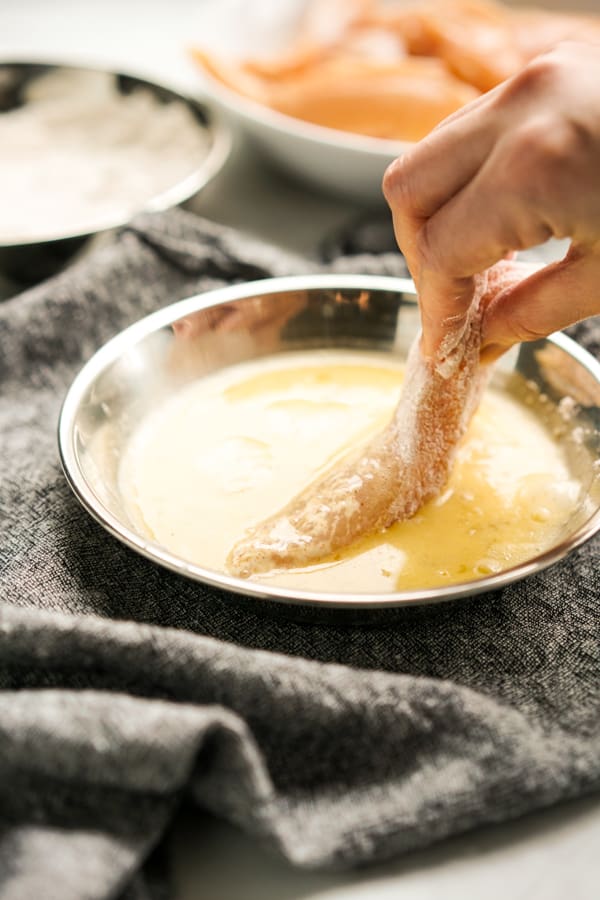 Coat chicken tenders in egg mixture