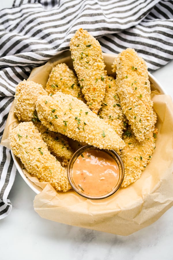 A basket of breaded chicken tenders