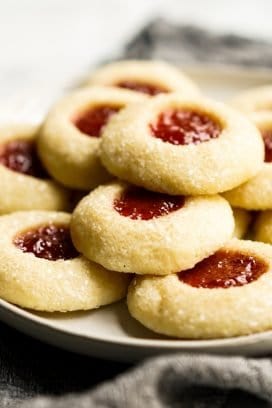 A plate of Strawberry Shortbread Thumbprint Cookies