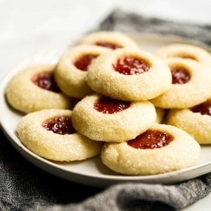 A plate of Strawberry Shortbread Thumbprint Cookies