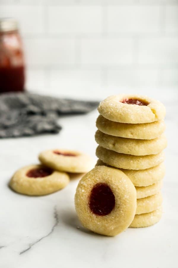 A stack of Thumbprint cookies filled with strawberry jam