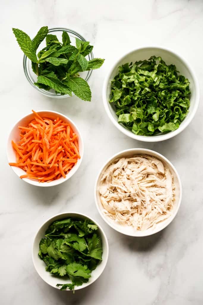 Mint leaves, lettuce, carrots, shredded rotisserie chicken, cilantro