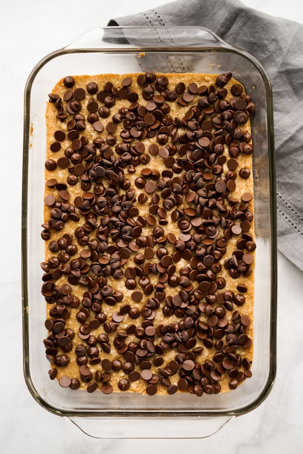 Chocolate chips on top of graham cracker crust