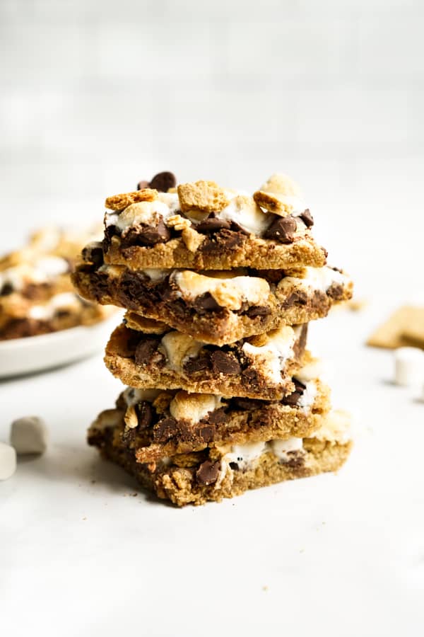 a stack of S'mores Bars with chocolate, graham crackers and marshmallow