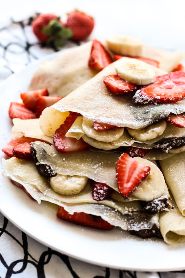 Closeup of strawberry banana nutella crepes