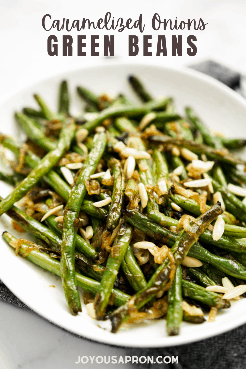 Green Beans with Caramelized Onions - A easy and delicious veggie side dish! Sweet caramelized onions sautéed with crunchy green beans, toss with garlic, butter, sea salt, then topped with shaved almonds.  via @joyousapron