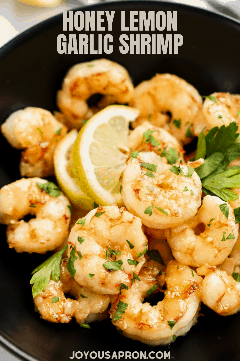 Honey Lemon Garlic Shrimp - Easy, quick and yummy skillet shrimp coated in a sticky Honey Lemon Garlic glaze, garnish with lots of cilantro. The secret is in the sauce! Ready under 15 minutes! via @joyousapron
