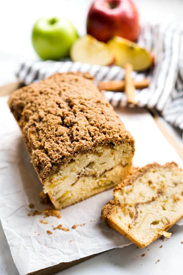 A loaf and a slice of apple bread