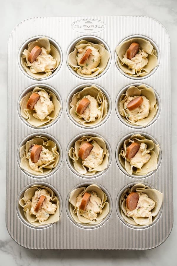 Unbaked Creole Cream Cheese Wontons in muffin tin