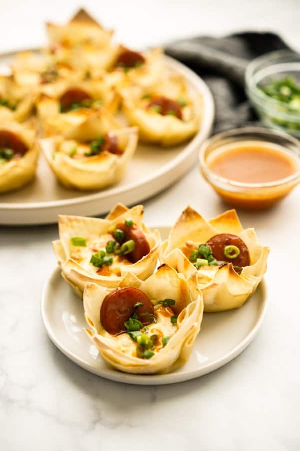 Cream Cheese Wonton Cups with dipping sauce in the background