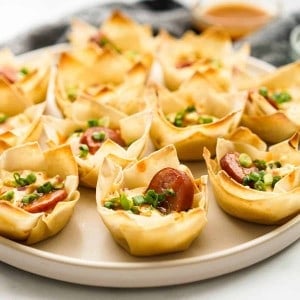 Wonton cups filled with cream cheese, sausage and green onions