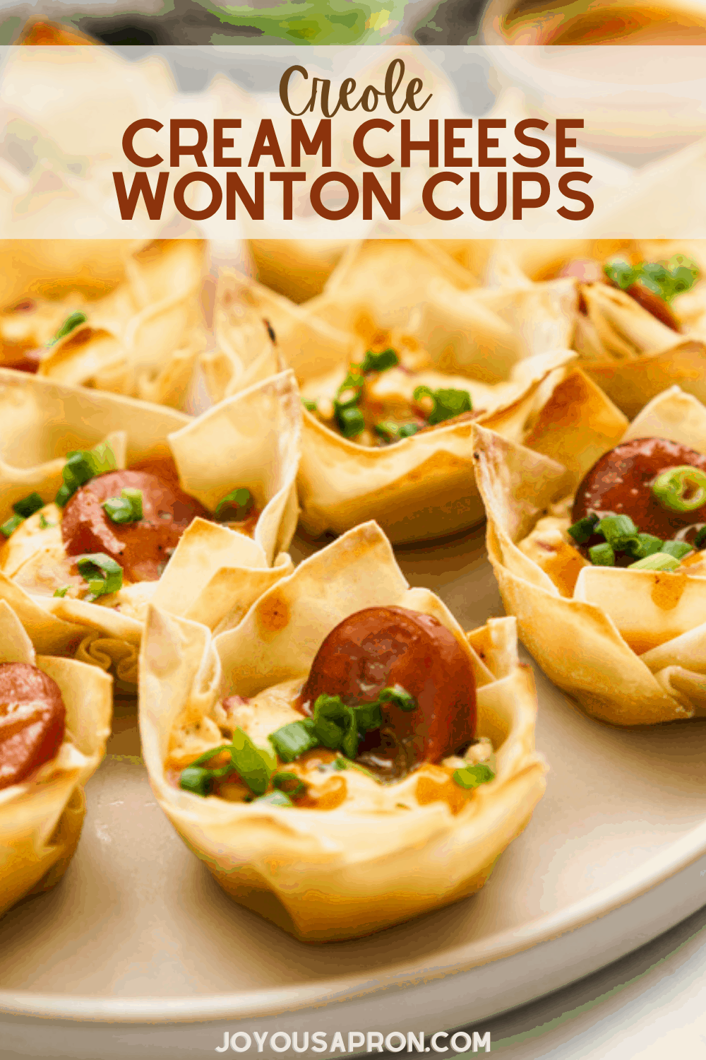 Creole Cream Cheese Wonton Cups - Mini bite sized Creole inspired crispy wonton cups filled with seasoned cream cheese mixture, sausage, green onions and drizzled with a tangy, zesty sauce! A fun twist to the classic cream cheese wontons. via @joyousapron