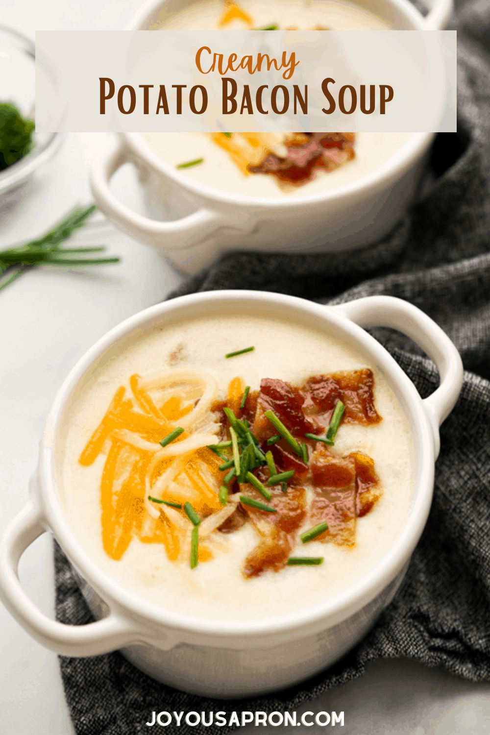 Creamy Potato Bacon Soup - cozy loaded baked potato soup! Chunky and creamy potato soup with bacon, cheese, sour cream and chives. Cozy and comforting, it's loaded potato in soup form! via @joyousapron