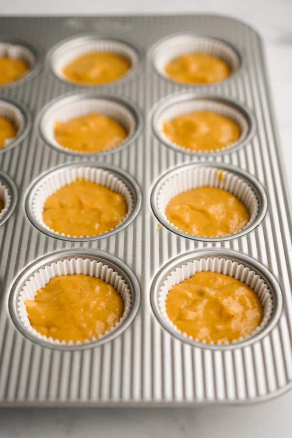Muffin tin with muffin liner and mixture