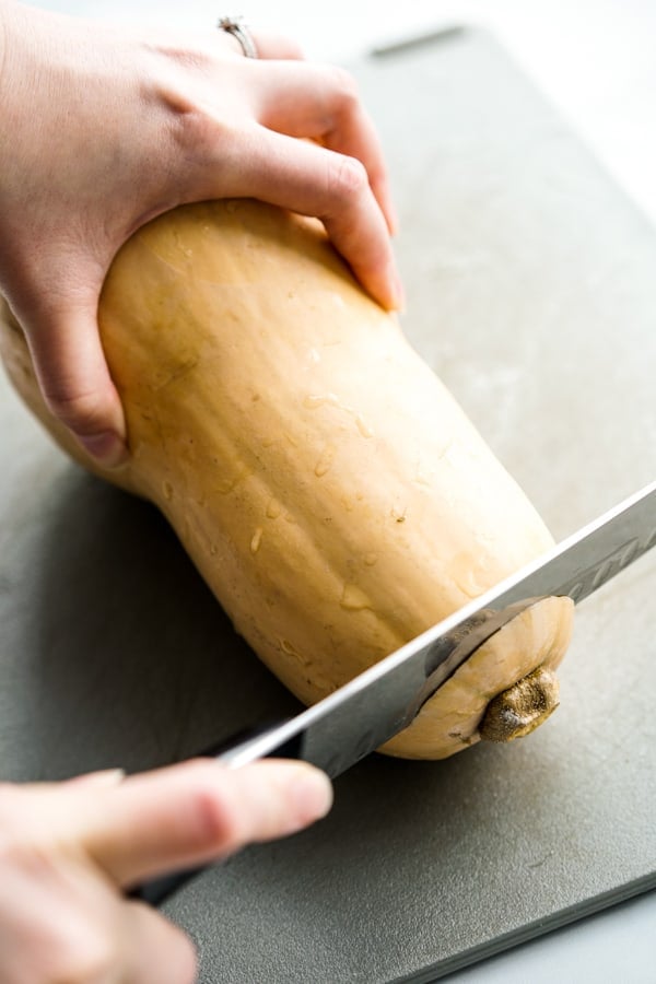 Cutting off the top of a butternut squash