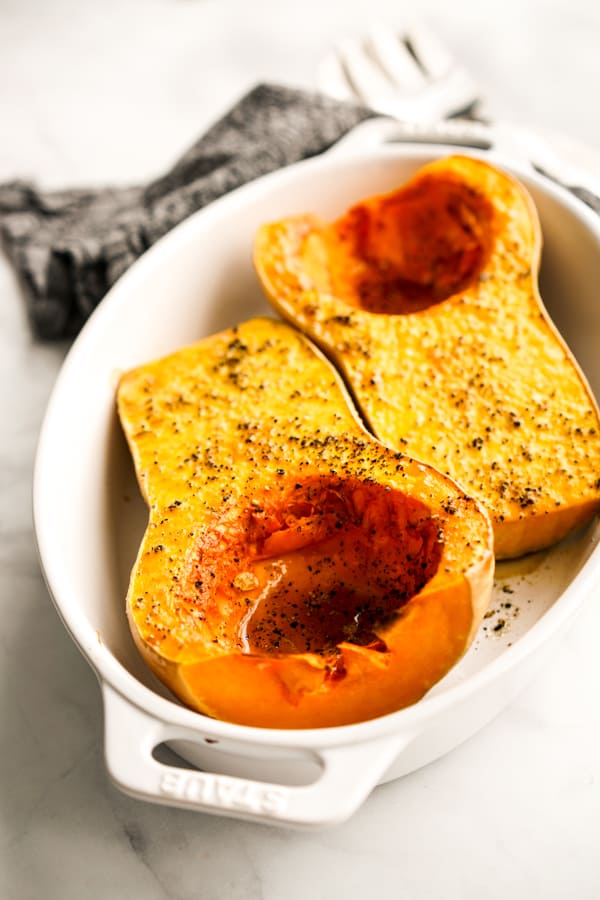 A oval bowl of two Whole Roasted Butternut Squash