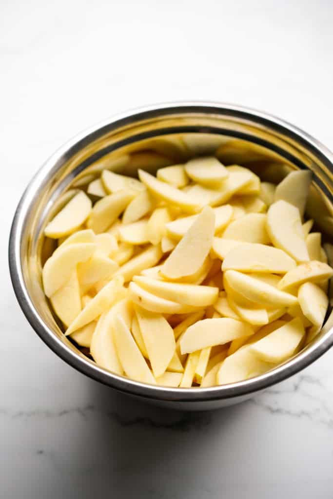 A large bowl of sliced apples