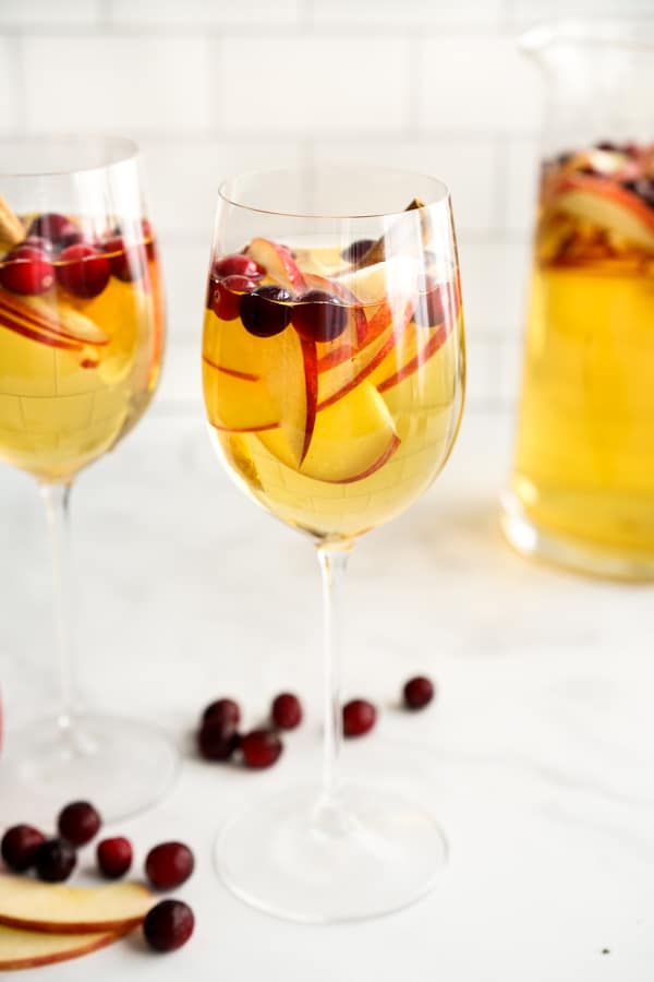 Sangria cocktail filled with cranberries and apples