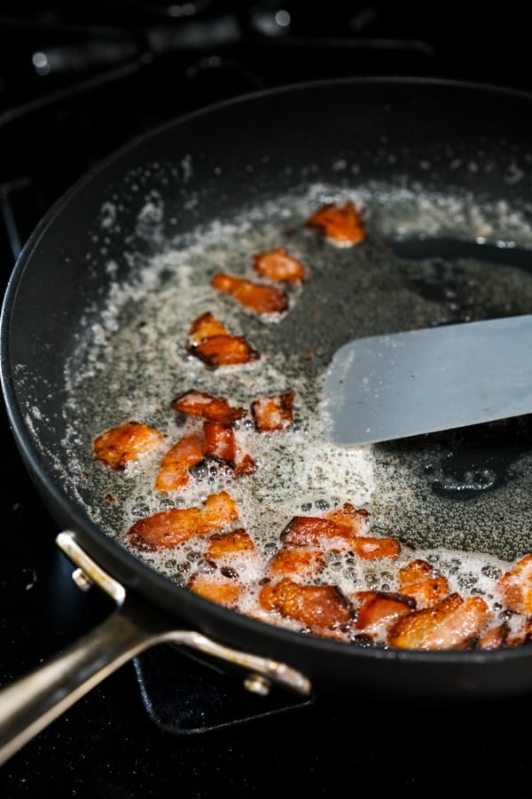 Pan frying bacon on a skillet