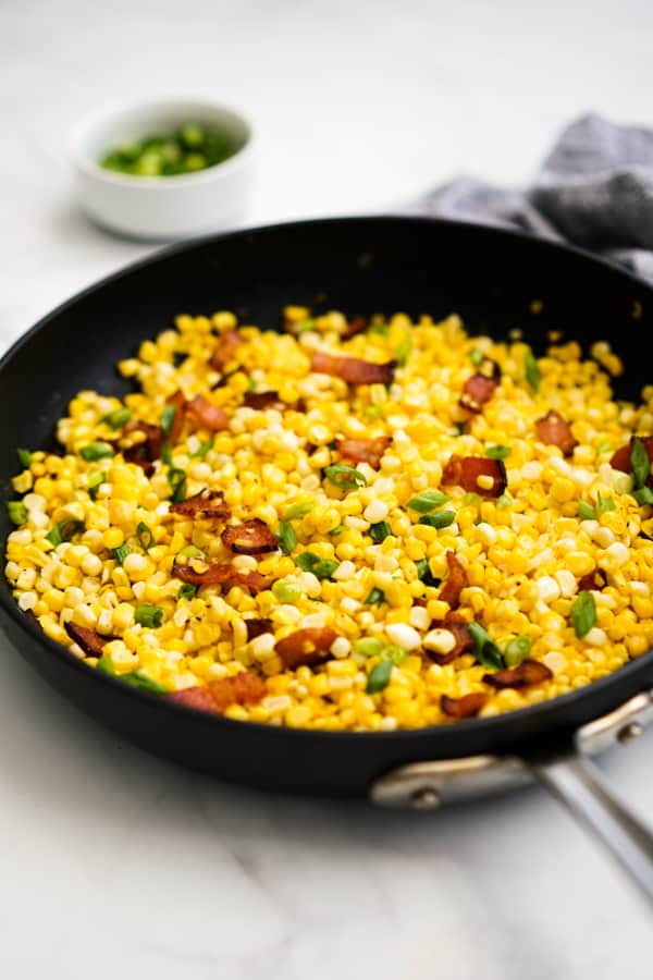 Skillet Corn with bacon and green onions on top