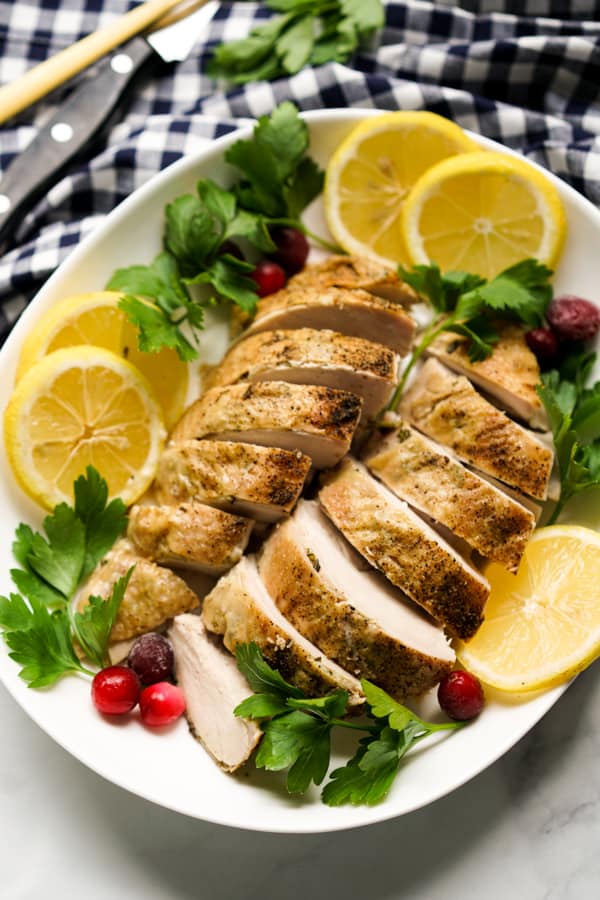 A platter of sliced skin-on turkey breast