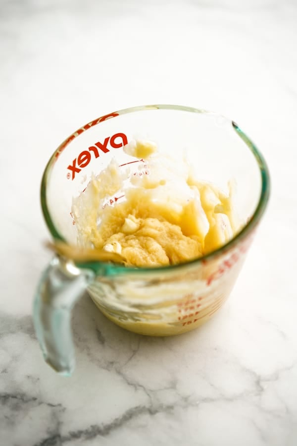 Honey butter in a measuring cup