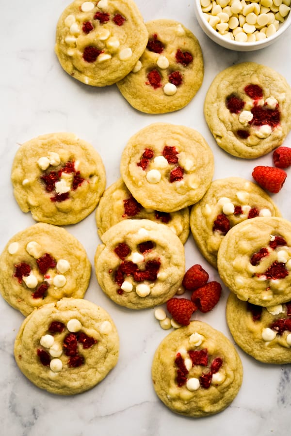 White Chocolate Raspberry Cookies spread out on the counter