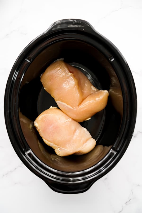 Raw chicken breasts in crockpot