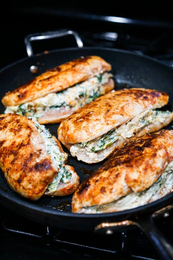 Raw chicken stuff with spinach artichoke