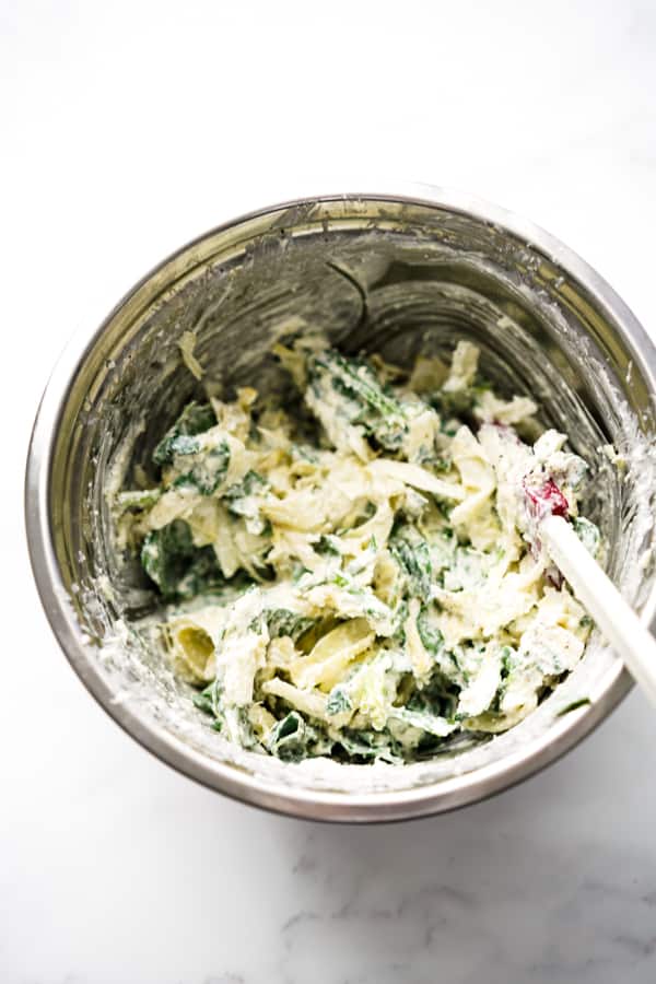 Spinach artichoke filling combined with cream cheese, mozzarella and parmesan