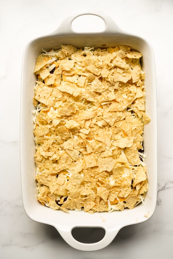 Casserole dish topped with crushed tortilla chips