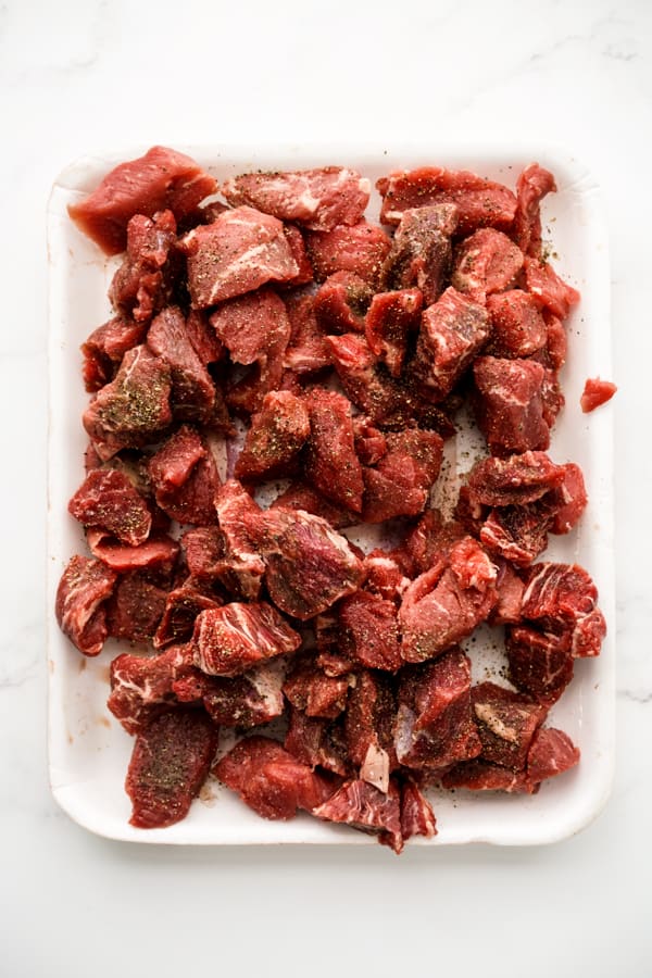 Beef chuck sprinkled with salt and black pepper on the surface