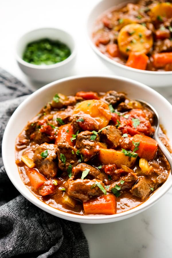 A bowl of thick chunky beef stew